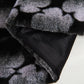 Combinación de funda de almohada y manta de piel sintética de Ballys 